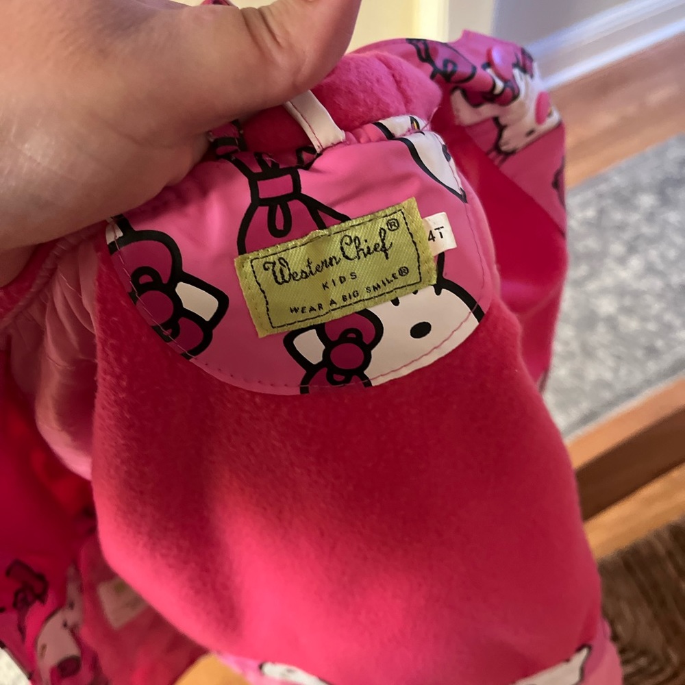 Size 4, in great condition - Hello Kitty pink and white rain coat.